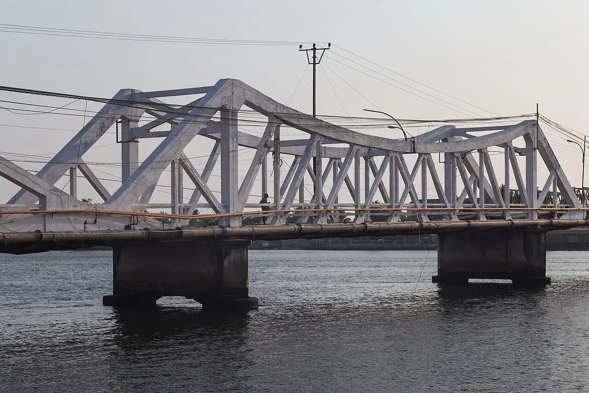 The old bridge over the river in Kampot, Cambodia.