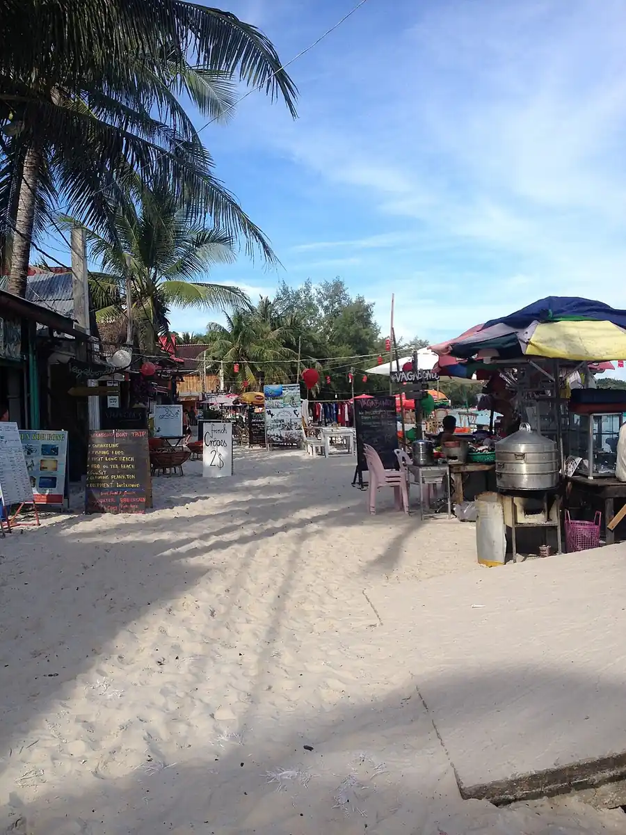 Boats and waterfront buildings along the shore at Koh Rong.